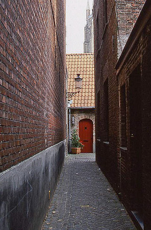 Alley, walls, and red door, Brugge, Belgium